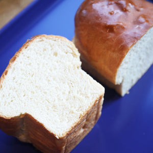 Overhead shot of a loaf of bread split in half