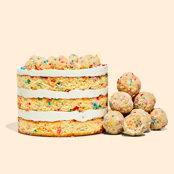 A 6" Birthday Cake next to a pile of b'day cake truffles.