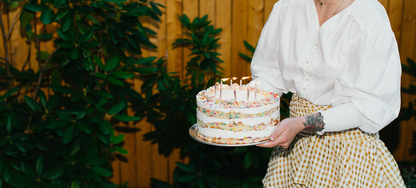 Woman holding birthday cake