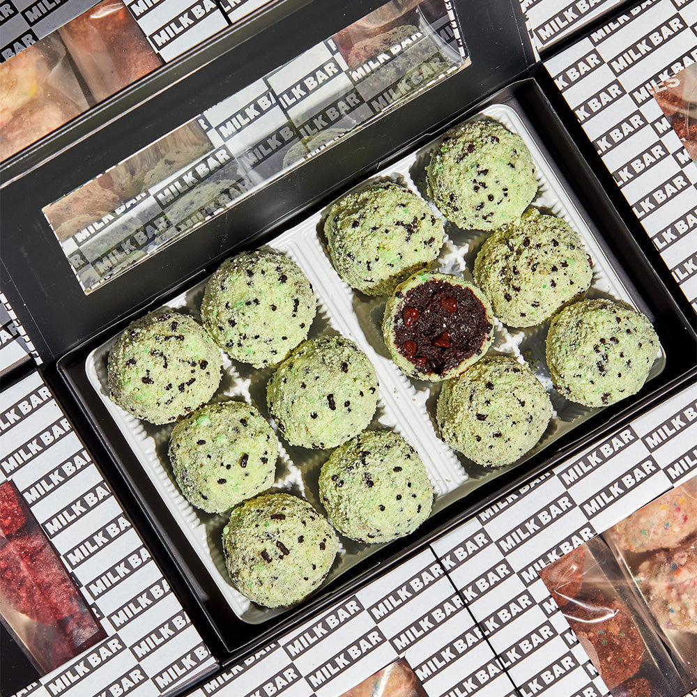 overhead view of an open branded giftable dozen box of Chocolate Mint Chip Cake Truffles.