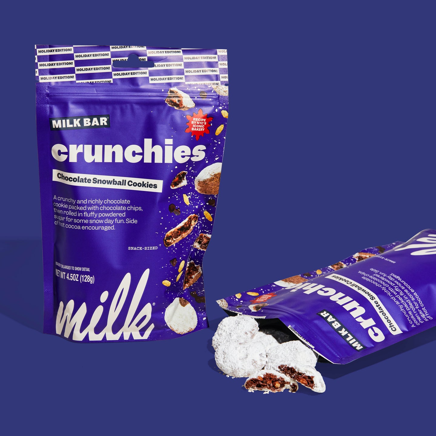 Front view of a bag of chocolate snowball crunchies, with cookies spilling out of the bag.