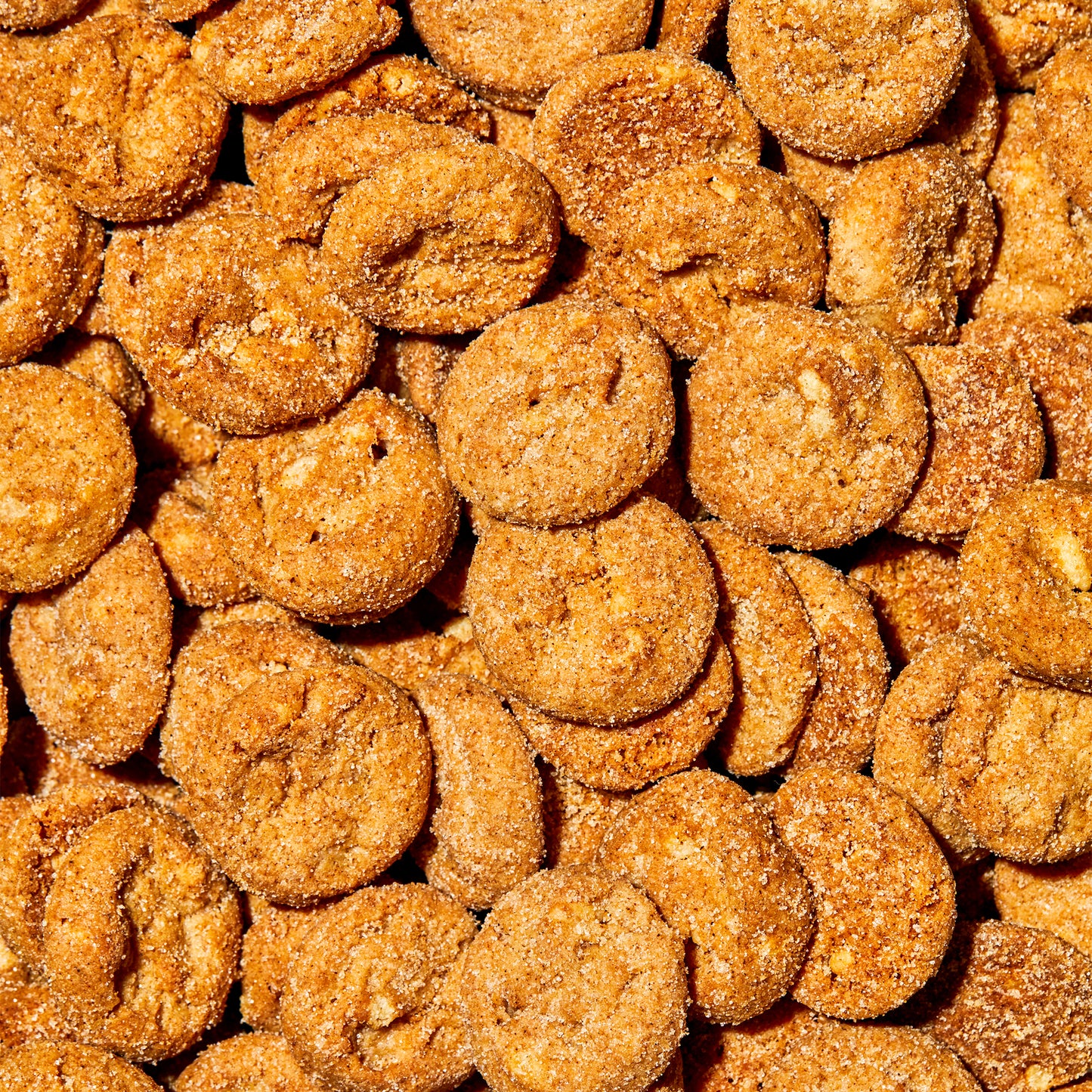 overhead macro view of a large pile of cinnamon toast super crunchy cookies