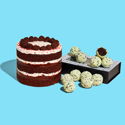 A 6" peppermint Bark Cake beside a dozen box of Chocolate Mint Chip Cake Truffles on top of their giftable branded box.