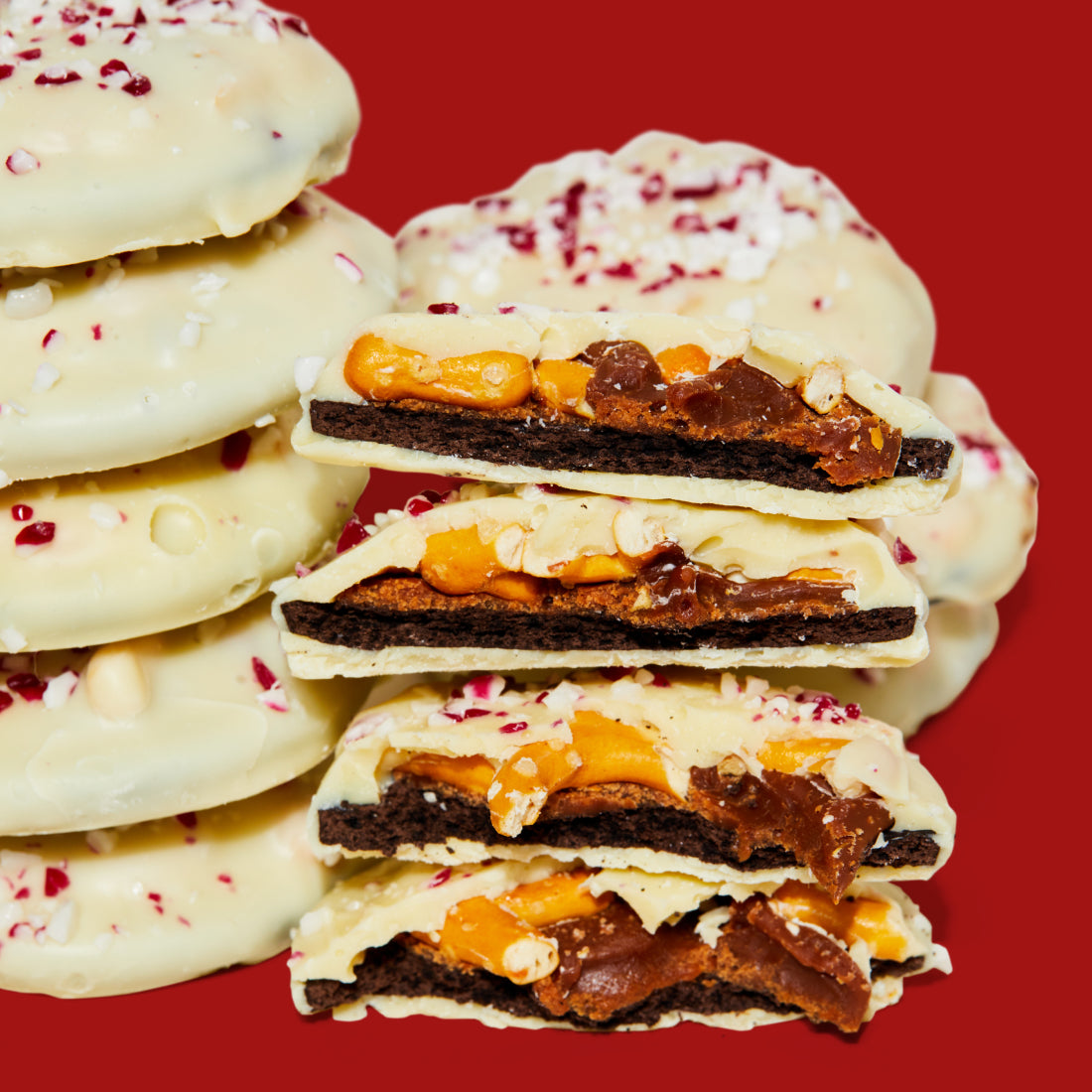 A stack of mini peppermint bark snap cookies sliced in half.
