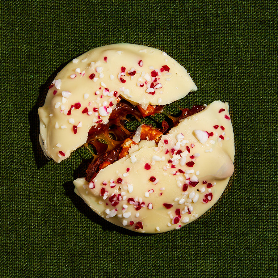 Overhead view of a single mini peppermint bark snap cookie.