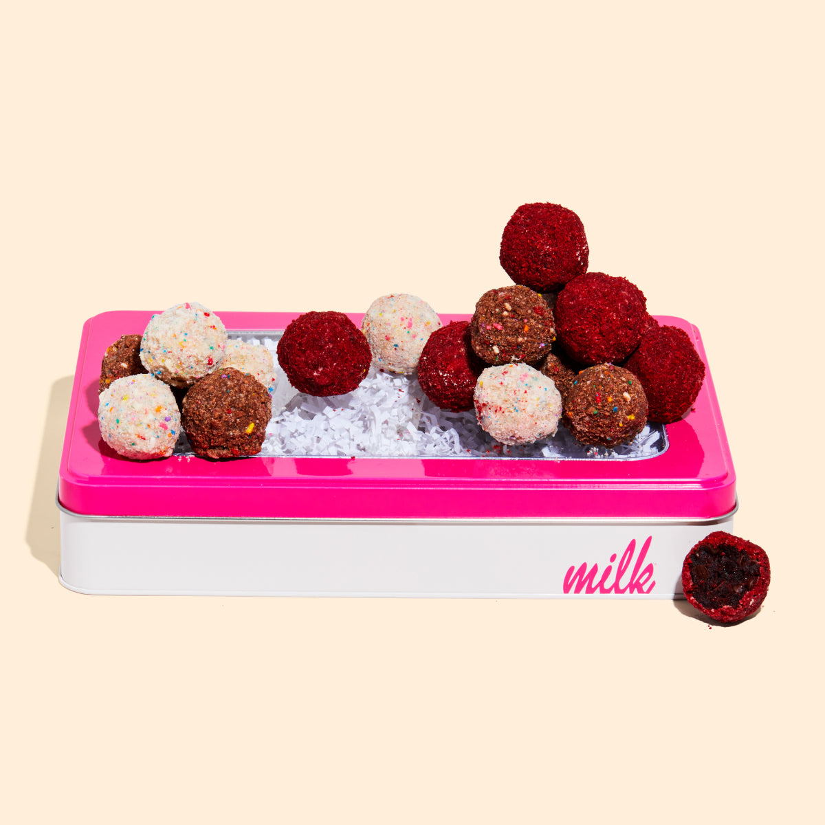 Assorted Truffle Box with a truffle pile on top.