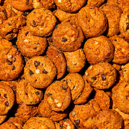 overhead macro view of a large pile of pretzel-y chocolate chip super crunchy cookies