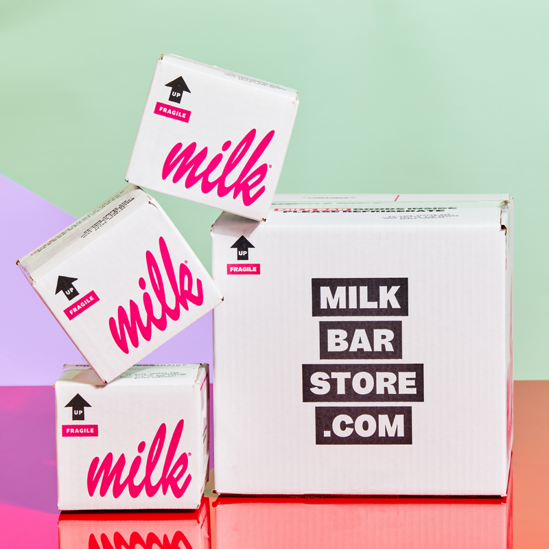 Milk Bar branded boxes stacked on top of each other.