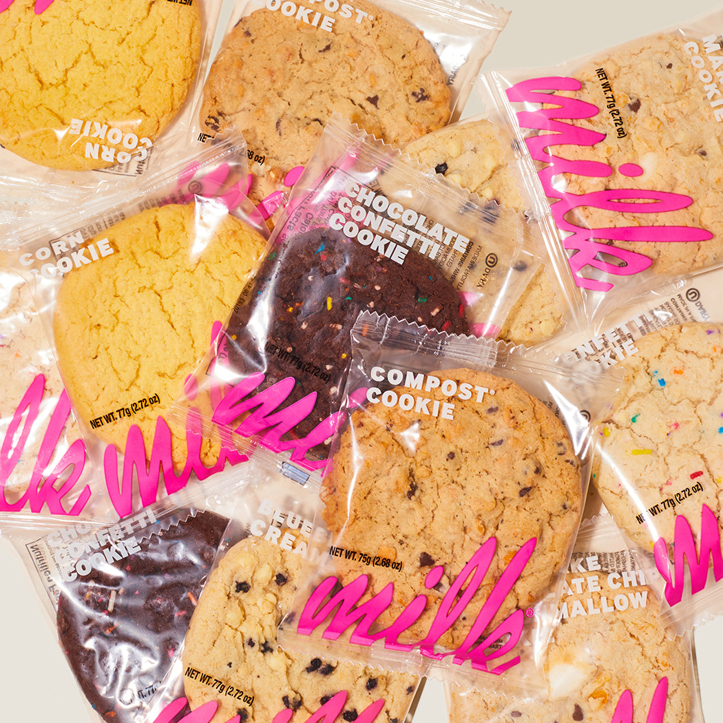 Overhead view of a spread of individually wrapped assorted cookies