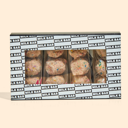 A front view of the birthday cake truffle dozen box with individually wrapped truffle 3-packs inside.