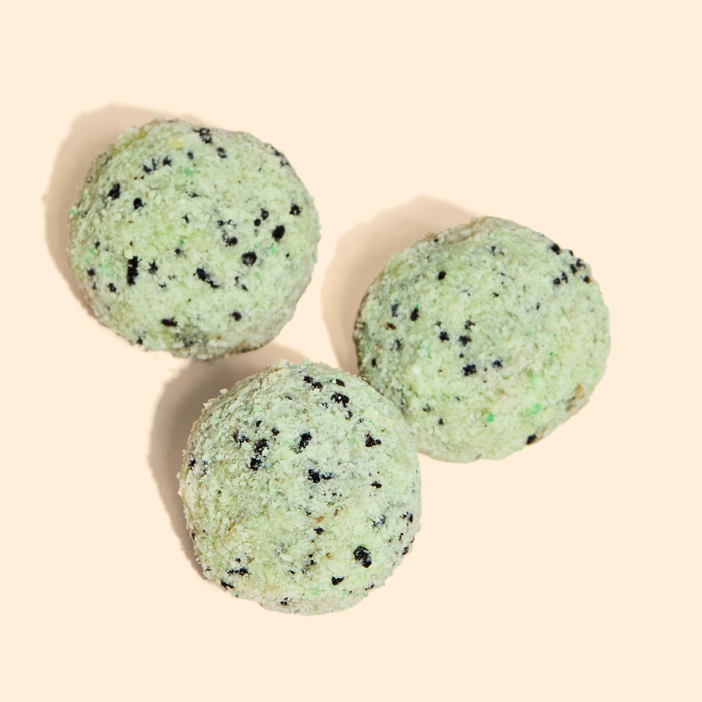 Overhead view of 3 Chocolate Mint Chip Cake truffles 