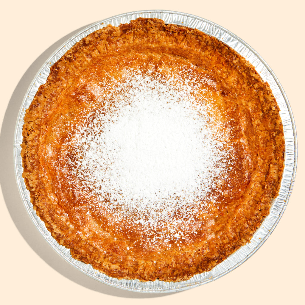 Overhead view of a whole milk bar pie.